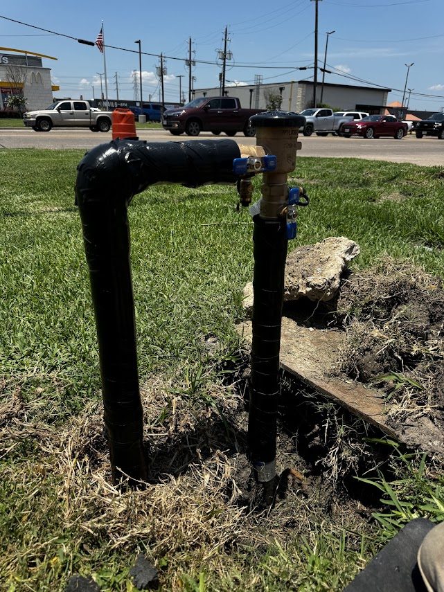 Insulated double-check backflow assembly on a roadside commercial line