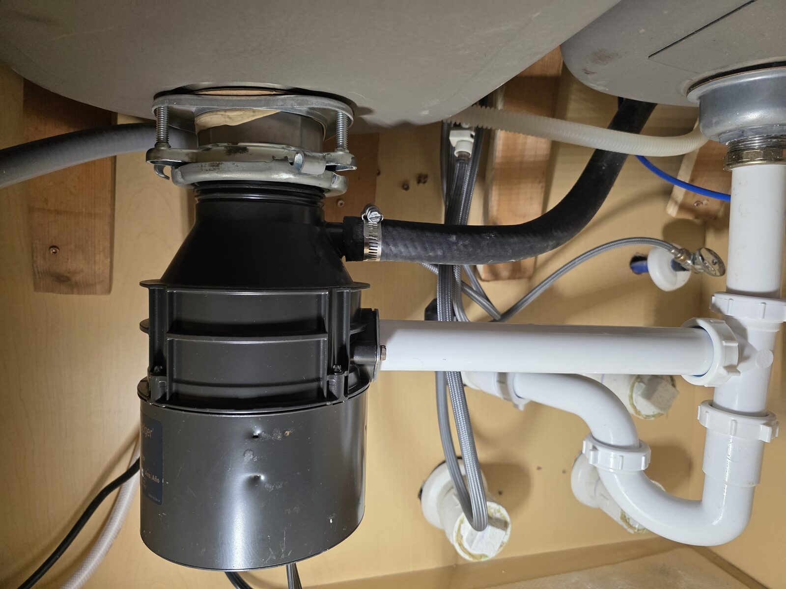 Garbage disposal installed under a kitchen sink
