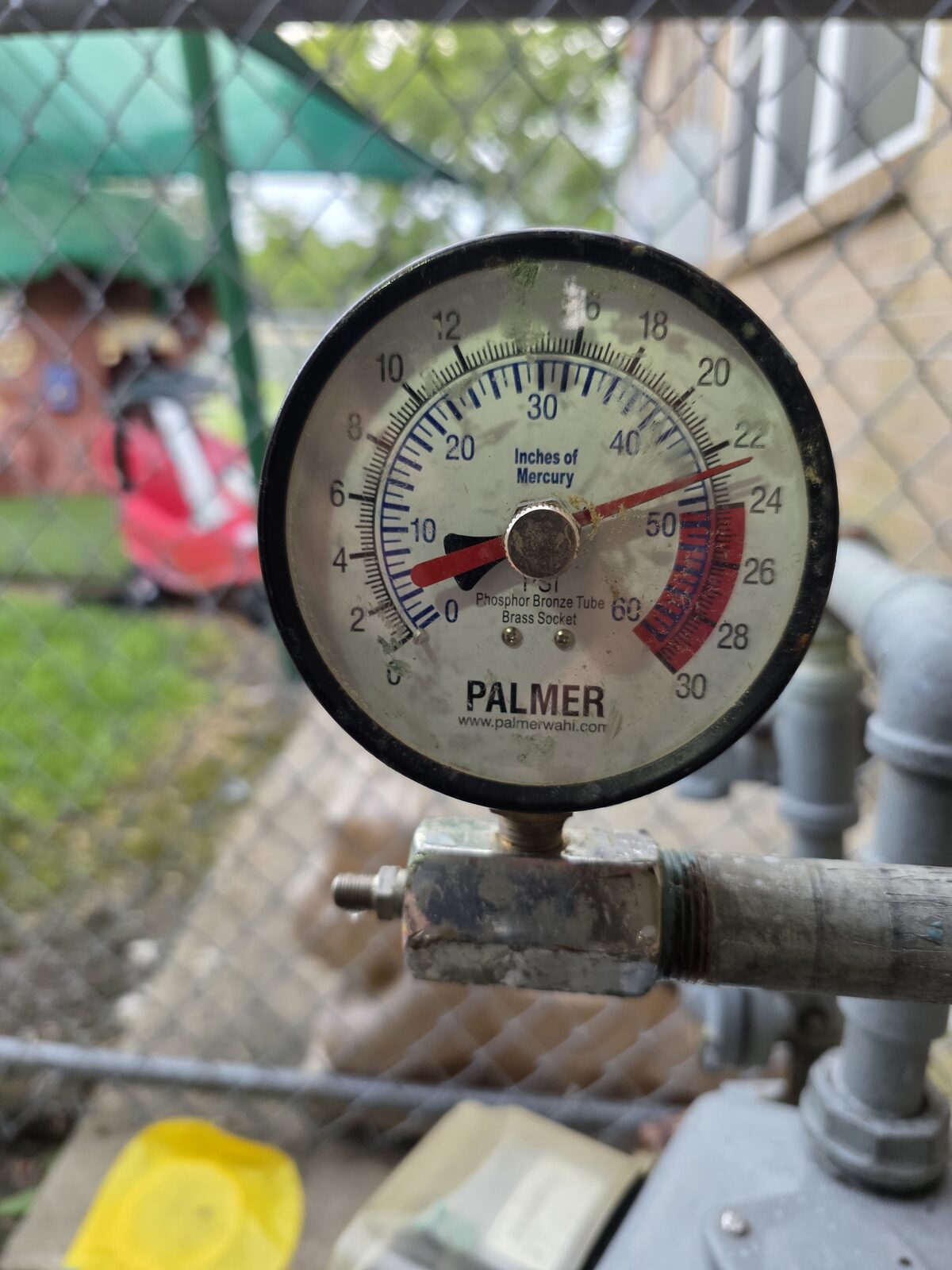 Palmer pressure gauge on a gas line during an annual pressure test at a licensed daycare