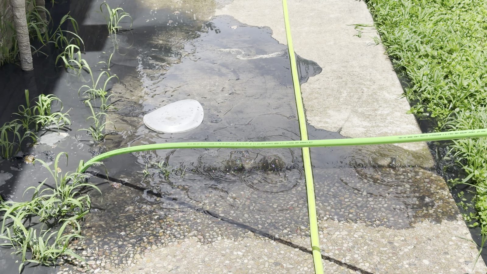 Hydro jetting hose running into a cleanout on an MVP Plumbing job