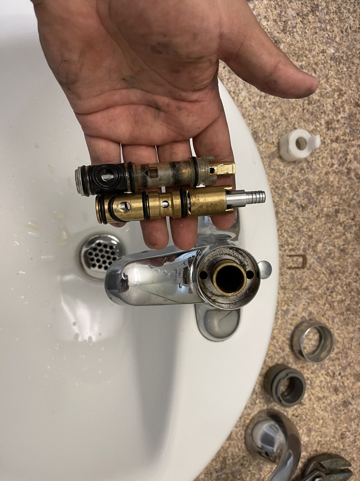 Lavatory faucet cartridge being replaced